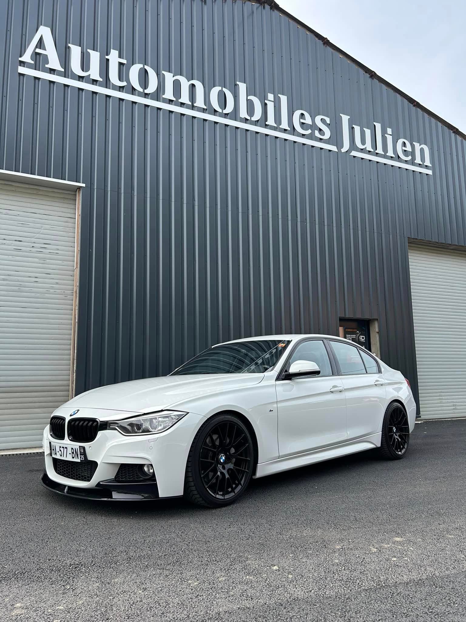 BMW devant le garage Automobiles Julien à Autechaux-Roide